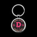 "Super Secret Share Spot" Pink D Emblem Round Stainless Steel Keychain